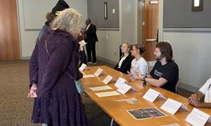 Students showcasing their exhibit contributions.